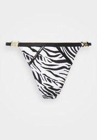 Bikini bottom in stampa zebra bianca e nera con design a vita bassa, caratterizzato da dettagli neri e accessori in oro sulle bretelle.