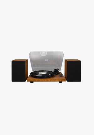 Turntable with a wooden base, transparent dust cover, black vinyl record, two black speaker cabinets, and control knobs on the side.