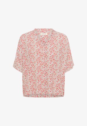 Viegls, īsām piedurknēm blūze gaiši krēmkrāsā ar ziedu rakstu rozā, sarkanā un zilā krāsā. Iespējas ietver v-veida kakla izgriezumu un pogu aizdari.