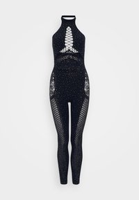 Black jumpsuit featuring a high neckline, fishnet mesh panels, and embellishments of small silver rhinestones throughout.