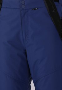 Marineblauwe skibroeken met een gladde textuur, voorzien van twee knopen, een logo-label en versterkte naden voor duurzaamheid.