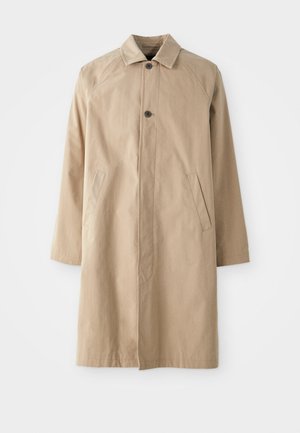 Beige frakk med krage, enkel knappelukking og to sidelommer. Laget av lettvektig stoff, med rett passform og lange ermer.