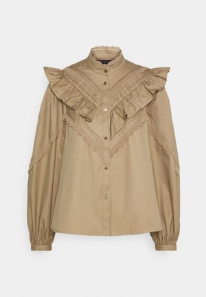 Kaki knap-op skjorte med flæsekrave, blonder på skuldrene og lange puffede ærmer. Lavet af glat stof.