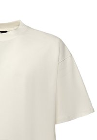 T-shirt met korte mouwen en ronde hals in off-white, gemaakt van zacht katoen; heeft een ruime pasvorm en minimale naden.