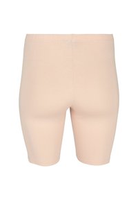 Beige-colored, knee-length seamless shorts with an elastic waistband, shown from the back on a white background.