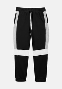 Zwarte en grijze joggingsbroek met witte horizontale strepen, elastische tailleband, trekkoord en zijzakken. Gemaakt van zachte katoenmix.