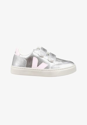 Silver metallic sneaker with pink accents, two Velcro straps, white sole, smooth texture, and a logo on the heel.