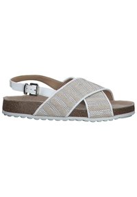 White sandals with cross bands featuring woven texture; cork sole with rubber tread; adjustable ankle strap with metal buckle.