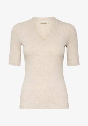 V-nyakú, rövid ujjú felső, könnyű bézs bordás anyagból, testesített szabással és finom textúrával.