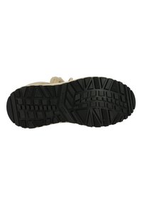 Zwarte rubberen zool met een multidirectioneel traction patroon; bovenwerk is gemaakt van licht beige textiel met een bontdetail en een versterkte neus.