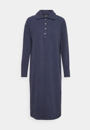 Robe polo bleu marine à manches longues, longueur genoux, avec col et quatre boutons sur la poitrine sur fond uni.