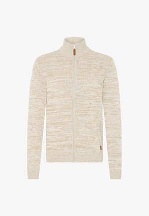 Beige og kremfarget melert strikket jakke med høy krage og lange ermer, og har en liten brun glidelåsdragning.