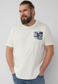 White cotton t-shirt with short sleeves, featuring a blue graphic print on the left chest depicting a vintage motel sign. Classic fit.