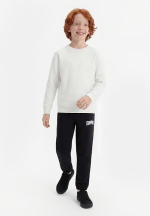 Champion COLLEGE PANTS - Spodnji deli trenirk - black