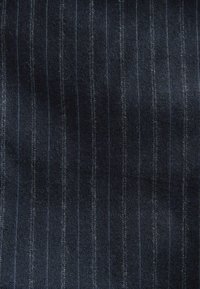 Wool fabric in navy blue, featuring subtle vertical pinstripes in light gray. Soft texture with a slightly fuzzy finish.