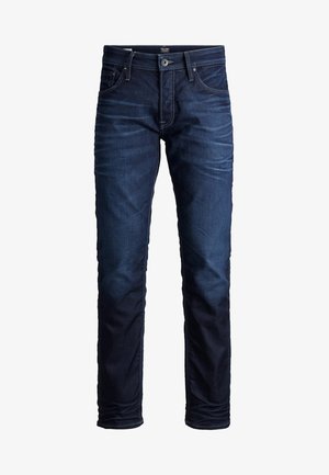 Dunkelindigo Jeans im Slim-Fit Schnitt, mit fünf Taschen, Knopfverschluss und kontrastierenden Nähten entlang der Säume.