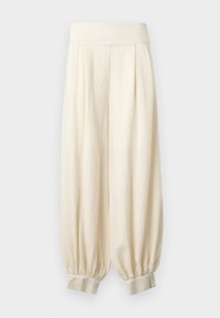 Φαρδιά εκρού παντελόνια με φαρδιά ελαστική μέση και μαζεμένα μανσέτες στους αστραγάλους, κατασκευασμένα από ελαφρύ ύφασμα.