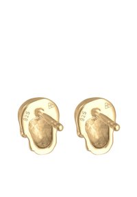Orecchini in tono oro con design di teschio, caratterizzati da superfici testurizzate e marchi impressi per la purezza del metallo (925). Stile a perno con chiusura a post.