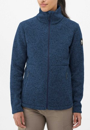 Veste polaire bleu foncé avec un col montant, fermeture éclair sur toute la longueur à l'avant et deux poches latérales. Présente un motif texturé et un logo sur la manche.