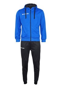 Sudadera azul con cremallera y detalles en negro, con capucha ajustable. Combinada con pantalones negros ajustados, ambos hechos de material deportivo suave.