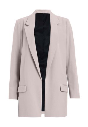 Blazer su misura beige chiaro con chiusura a un bottone, revers a punta e due tasche frontali. L'interno è foderato in nero.