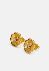 Gold floral earrings with a textured finish, featuring a central clear gem. The flowers have scalloped edges and a polished design.