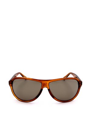 Occhiali da sole tartarugati marroni con grandi lenti scure e montatura arrotondata in stile aviator su sfondo bianco.