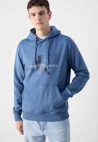 Calvin Klein Jeans SEASONAL MONOLOGO REGULAR HOODIE - Ikdienas džemperis - blue coast