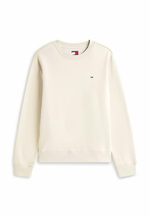 Kremowy sweatshirt z okrągłym dekoltem, ściągaczami przy mankietach i dolnym hemie. Posiada małe logo na lewej piersi. Gładka faktura.