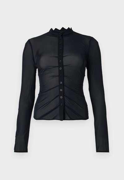 Black long-sleeve button-up shirt in sheer fabric with a ruffled collar, featuring ruched detail and fabric-covered buttons down the front.