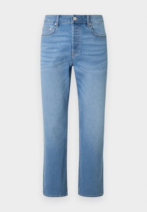 Lyseblå denimjeans med lige ben, forlommer, bæltestropper, knaplukning og diskret falmen omkring hofter og lår.