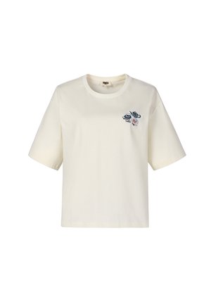 T-shirt court à manches courtes couleur crème avec col rond et petit design abstrait brodé en bleu, noir et rouge sur la poitrine gauche.