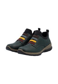 Des chaussures à enfiler vert foncé avec des semelles noires texturées, des sangles élastiques multicolores en bordeaux, jaune, gris et marron sur le dessus.