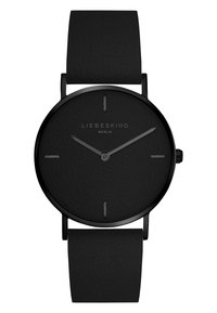Orologio nero con cinturino in pelle texturizzata, quadrante rotondo minimalista, indici e lancette neri, con il marchio 'LIEBESKIND BERLIN'.