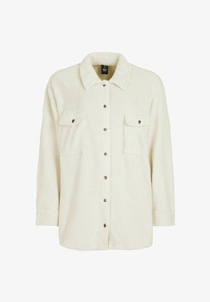 Kermanvärinen fleece-paitatakki, jossa on kaulus, kaksi rintataskua ja nappi- edessä. Ominaisuuksiin kuuluu teksturoitu, pehmeä pinta.