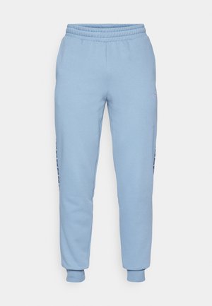Lyseblå joggebukser lavet af en bomuldsblandingsmateriale, der har en elastisk talje og manchetter, med side-logo accenter og en tætsiddende pasform.