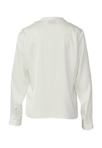 Weißes langärmliges Hemd mit einfachem Kragen, geknöpften Manschetten und glatter Textur; verfügt über eine Rückennaht und eine lockere Passform.