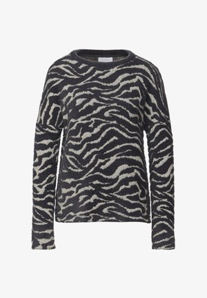 Wollige lange mouw trui in zwart en crème met een zebraprint. Voorzien van een ronde halslijn en een losse pasvorm. Zachte textuur.