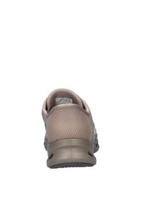 Sneaker beige con tomaia in rete traspirante, suola ammortizzata e tallone rinforzato. Design semplice con bordi arrotondati e superficie liscia.