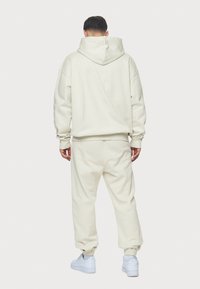Pegador LOGO JOGGER - Træningsbukser - washed salty cream