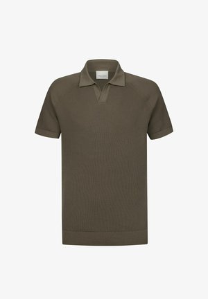 Polo manches courtes vert olive avec une texture côtelée, doté d'un col cranté et fini par un ourlet droit.