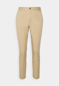 Beiga chinos med rak passform. Tillverkade av bomull, med knappstängning, bälteshällor och rena sömmar. Mjuk textur och slät finish.