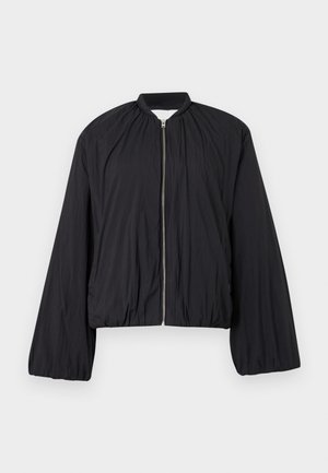 Black bomber jacket featuring a zip front, elasticated cuffs, and a slightly cropped silhouette. Made from lightweight, textured fabric.