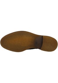 Suela de zapato con un material de goma texturizada en marrón, que presenta una forma redondeada y una sección elevada en el talón para proporcionar amortiguación.