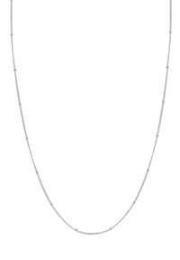 Srebrny naszyjnik łańcuchowy z małymi, rozstawionymi okrągłymi akcentami, osadzonymi na delikatnym wzorze ogniw. Długość naszyjnika jest odpowiednia do noszenia blisko szyi.