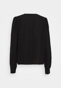 Zwarte blouse met lange mouwen, opgepofte schouders en knoopmanchetten, plat uitgespreid tegen een witte achtergrond.