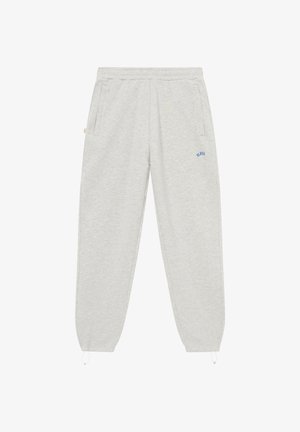 Pantalones deportivos gris claro con cintura elástica, bolsillos laterales, puños elásticos con cordones ajustables y pequeño logo azul "BLKVS" en el muslo derecho.