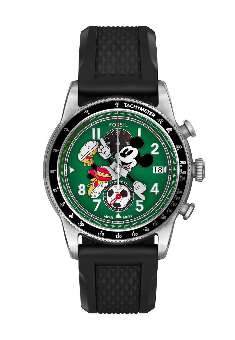Green watch face with Mickey Mouse in soccer outfit, black textured strap, chronograph dials, date display, and tachymeter bezel.