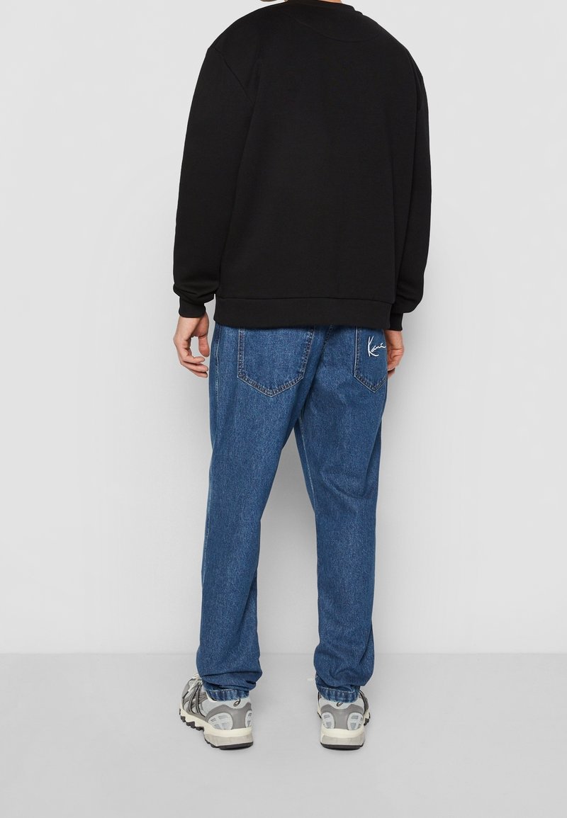 Karl Kani Sweatshirt black/schwarz (Pre-owned) Zalando