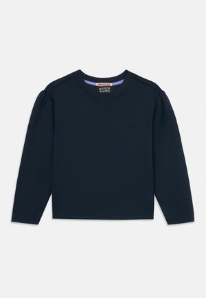 Mørkeblå langærmet skjorte lavet af blødt stof. Har en rund halsudskæring, let puffede ærmer og et lille logo på brystet.